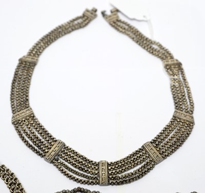 Lot 218 - A group of continental white metal necklaces.