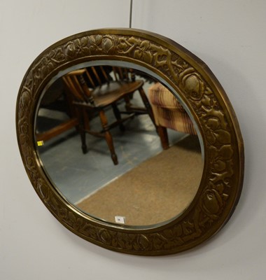 Lot 54 - An ornate  embossed brass oval mirror