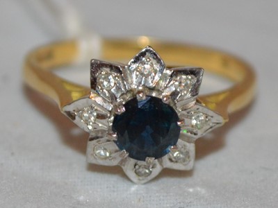 Lot 212 - A sapphire and diamond cluster ring