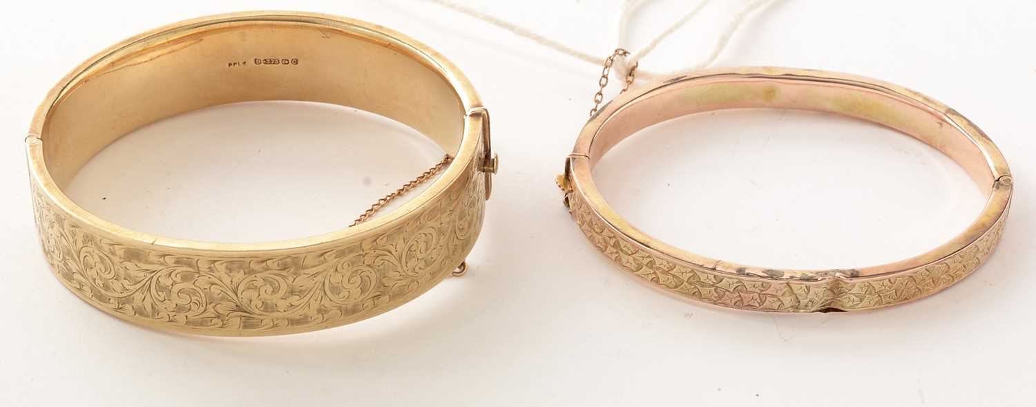 Lot 169 - Two 9ct gold hinged bangles.