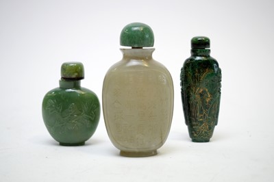 Lot 319 - Three green hardstone snuff bottles
