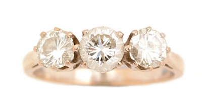 Lot 60 - A three stone diamond ring