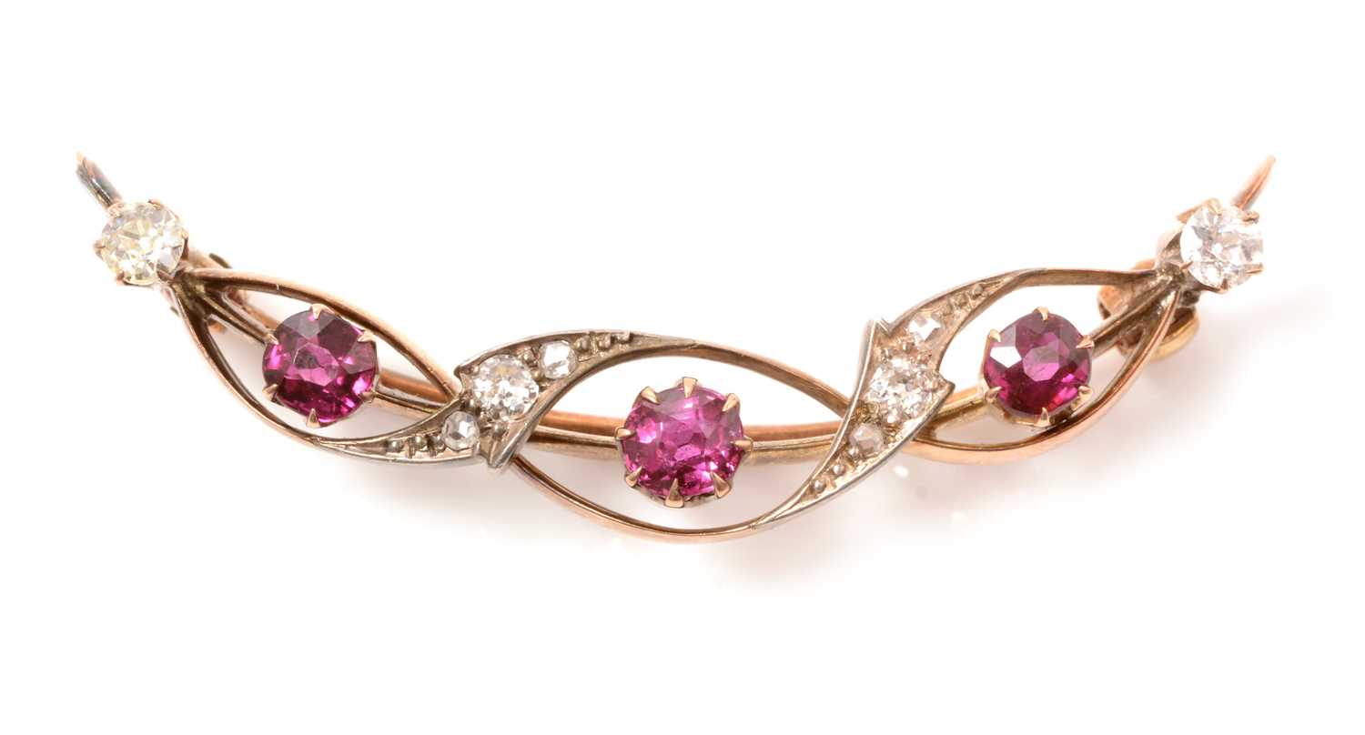 Lot 148 - A late 19th Century ruby and diamond crescent brooch