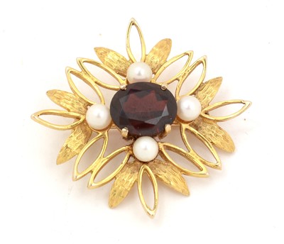 Lot 112 - A 9ct gold, garnet and pearl brooch.