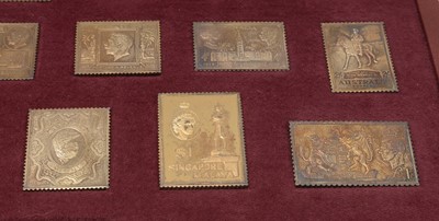 Lot 161 - "The Empire Collection" a limited-edition silver-gilt postage stamp ingot set.