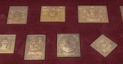Lot 161 - "The Empire Collection" a limited-edition silver-gilt postage stamp ingot set.