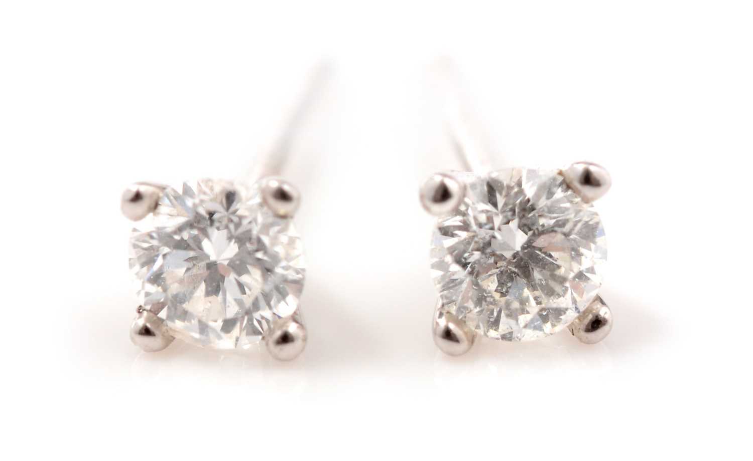 Lot 151 - A pair of diamond stud earrings