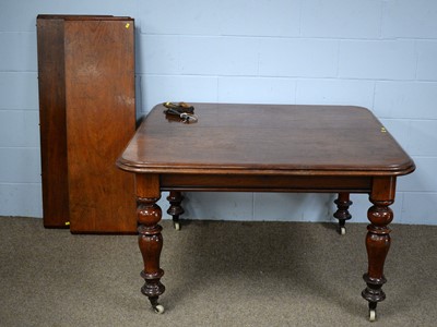 Lot 54 - A Victorian mahogany wind-out extending dining table