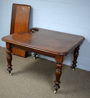 Lot 54 - A Victorian mahogany wind-out extending dining table