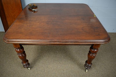 Lot 54 - A Victorian mahogany wind-out extending dining table