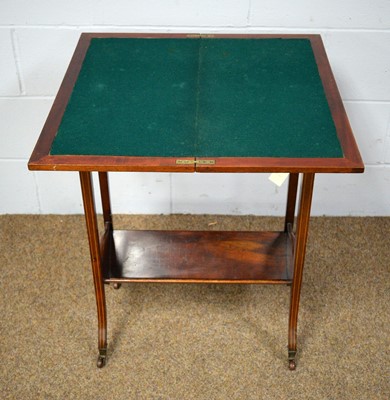 Lot 49 - An Edwardian fold-over card table of small proportions
