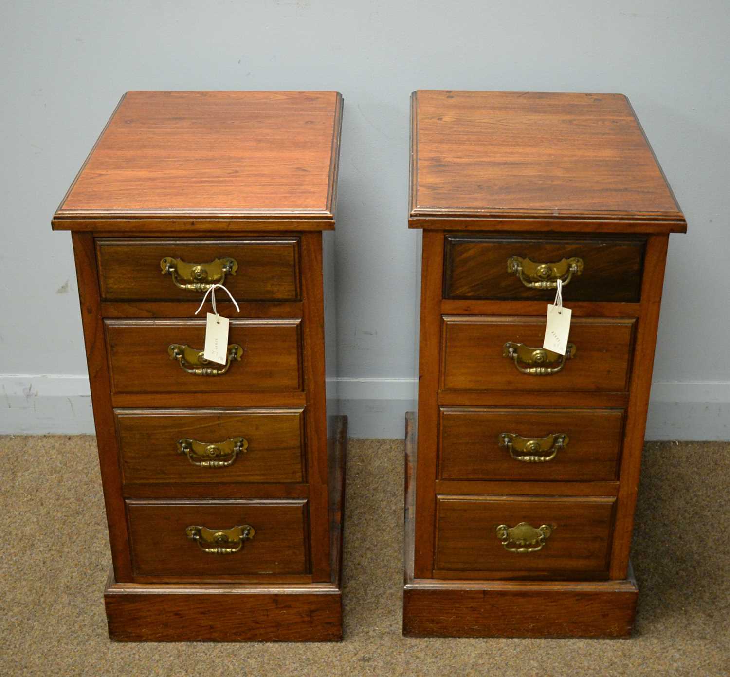 Lot 174 - Pair of walnut narrow chests of four drawers.