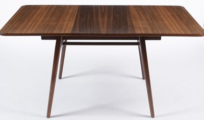 Lot 657 - Everest: a mid Century walnut extending draw leaf dining table.