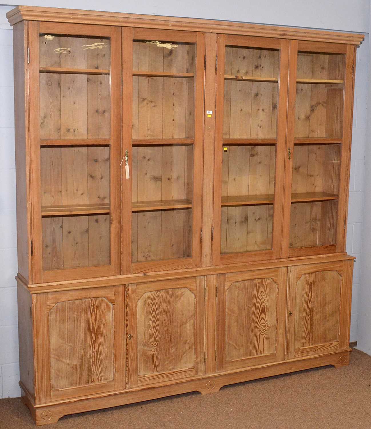 Lot 62 - A large pitch pine bookcase