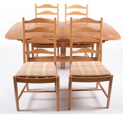 Lot 25 - Ercol: modern elm refectory style extending dining table; and four dining chairs.