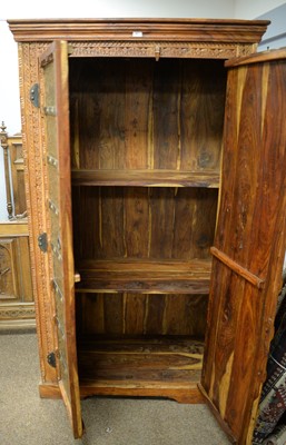 Lot 67 - A 20th Century Asian hardwood two door wardrobe