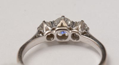 Lot 83 - A three-stone diamond ring.
