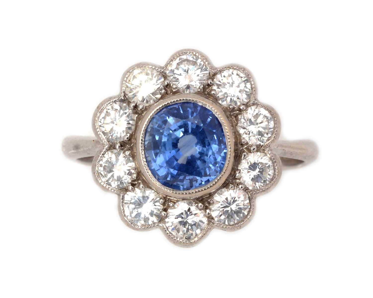 Lot 88 - A sapphire and diamond cluster ring