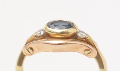 Lot 103 - A modern diamond and sapphire three-stone ring.