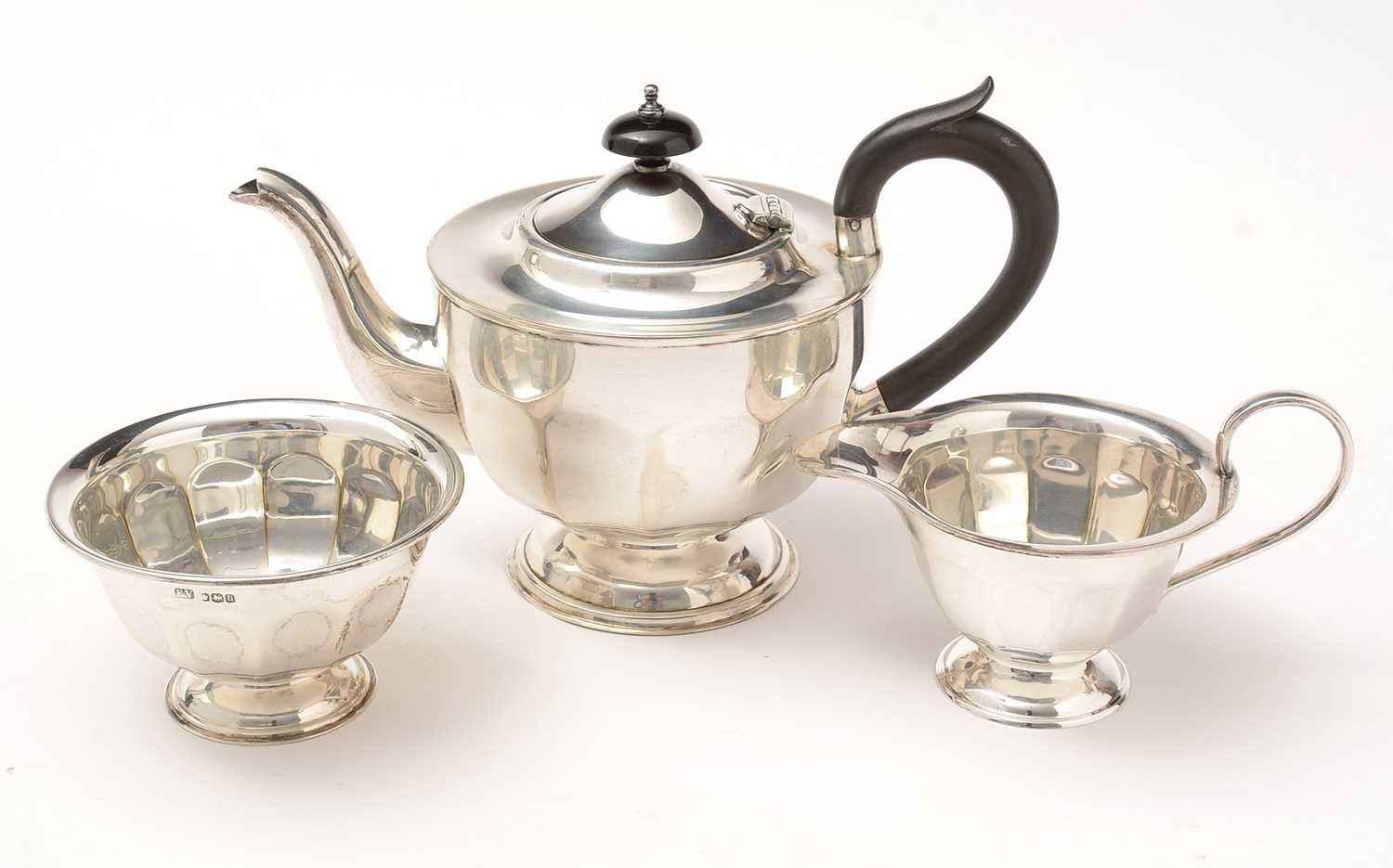 Lot 193 - A George V silver three-piece tea set.