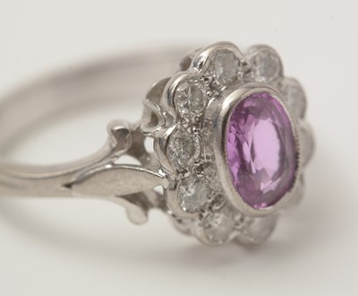 Lot 48 - A pink sapphire and diamond cluster ring
