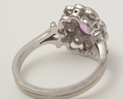 Lot 48 - A pink sapphire and diamond cluster ring