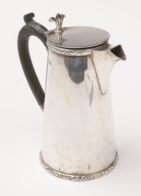 Lot 198 - An Edwardian silver hot water jug.