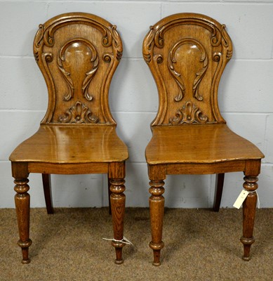 Lot 21 - A pair of early Victorian oak hall chairs