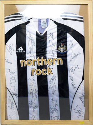 Lot 639 - A Newcastle United home shirt signed by the team.