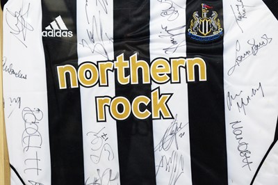 Lot 639 - A Newcastle United home shirt signed by the team.