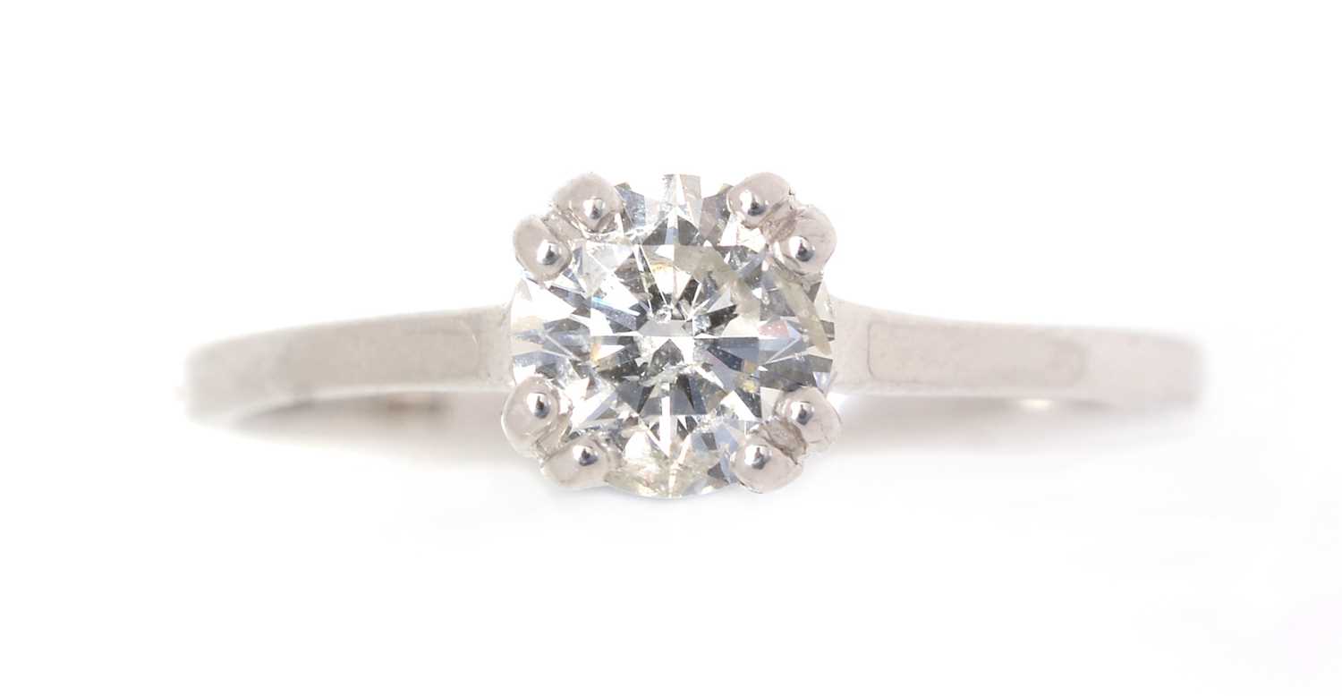Lot 58 - A solitaire diamond ring.