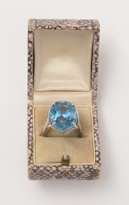 Lot 114 - A topaz and diamond dress ring.