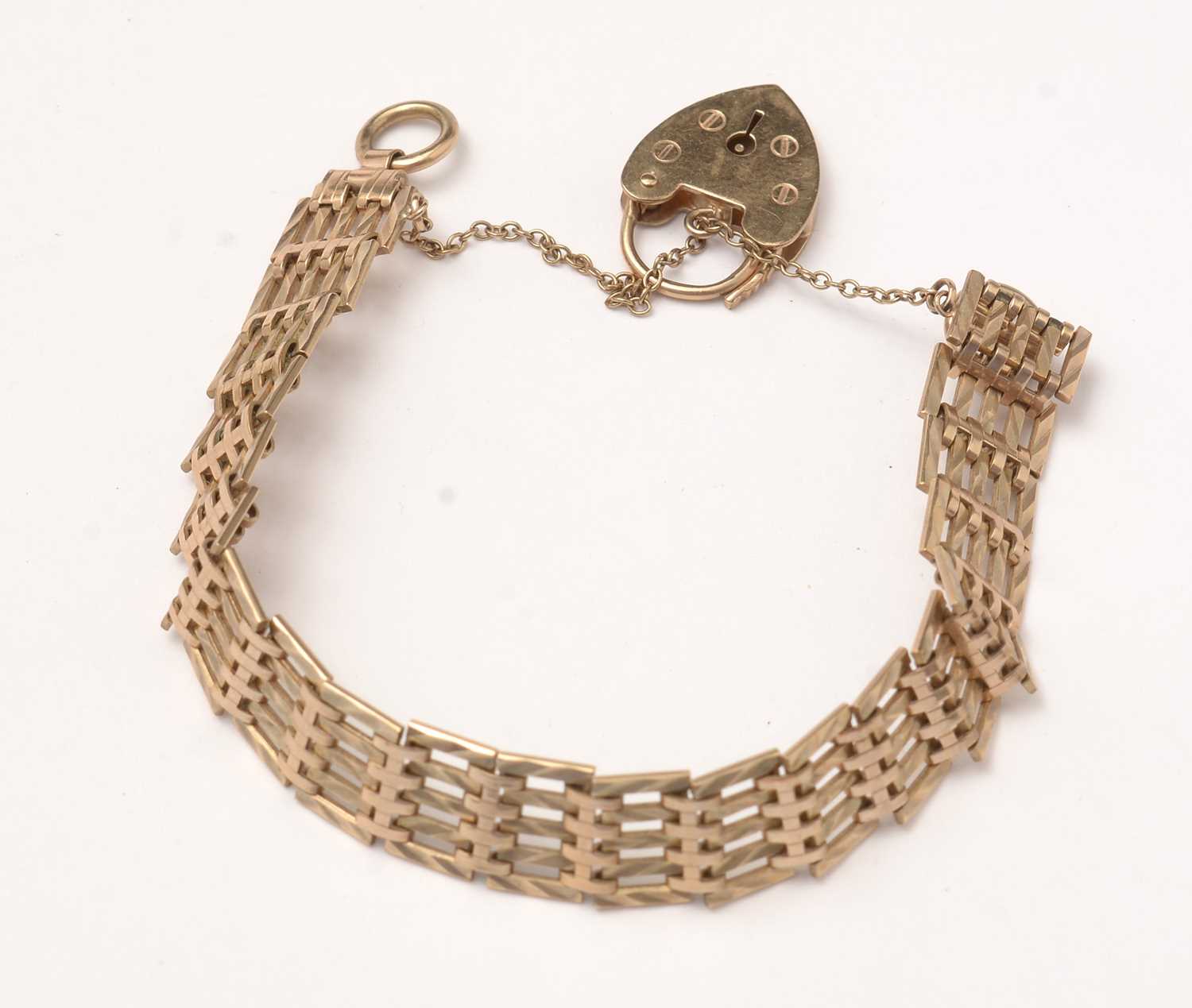Lot 135 - A 9ct gold gate-link bracelet.