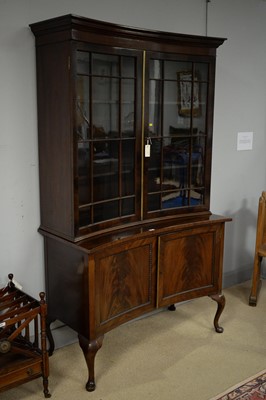 Lot 247 - An Edwardian mahogany concave fronted bookcase