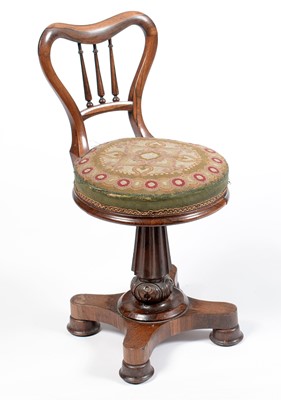 Lot 616 - A Victorian rosewood balloon-back harpists chair.