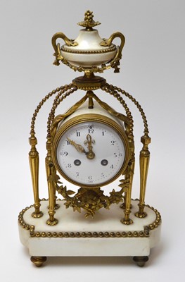 Lot 560 - Vincenti & Cie, France: a white stone and gilt metal mantel clock