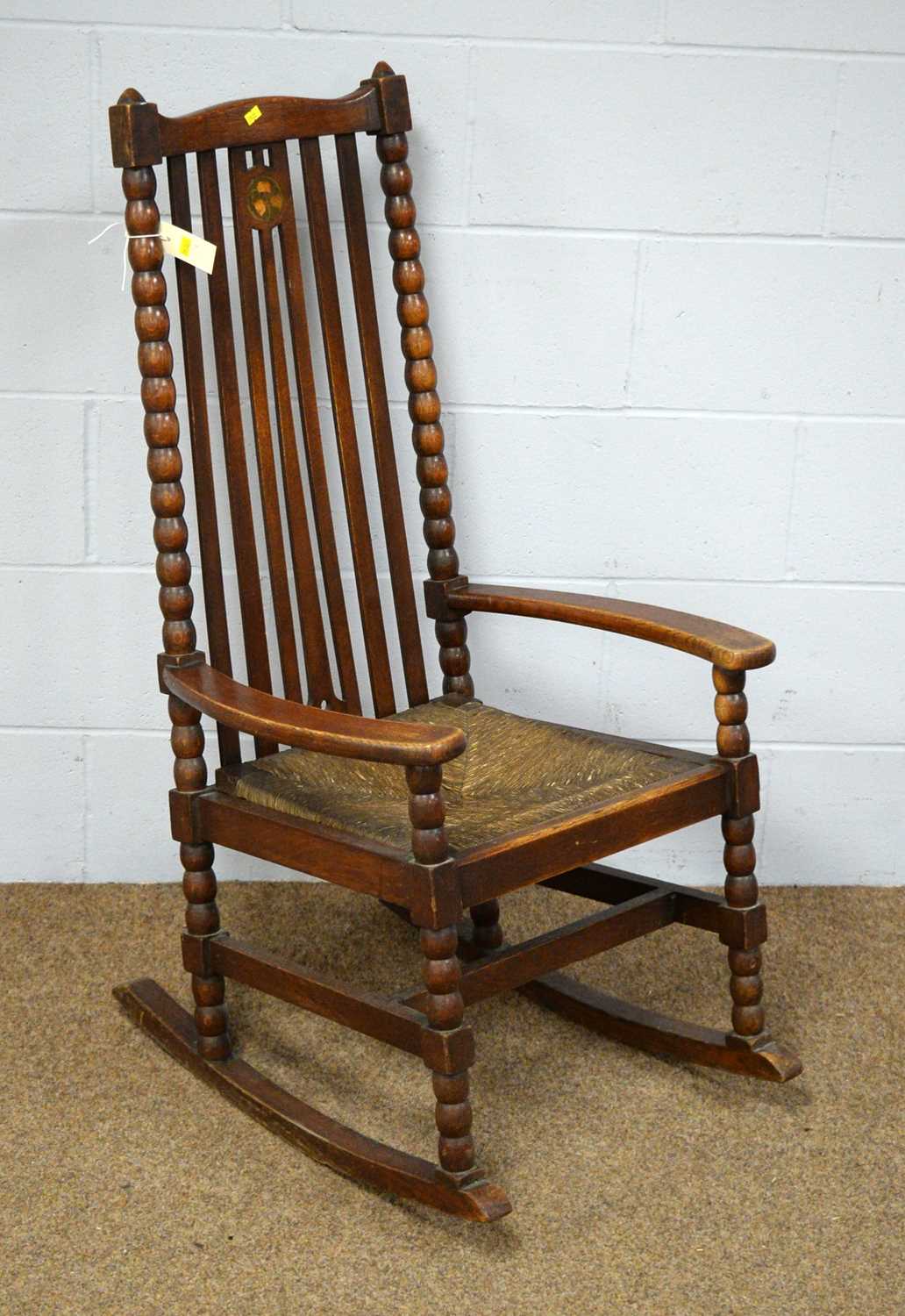 Lot 17 - Arts & Crafts oak rocking chair.