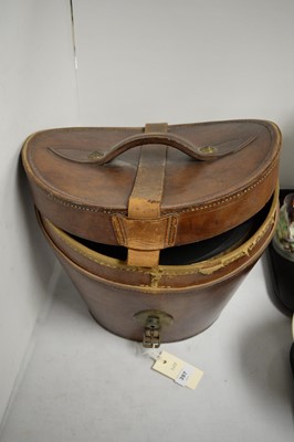 Lot 397 - Two gent's top hats, one in leather hatbox.