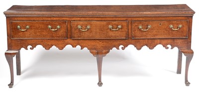 Lot 645 - George III oak low dresser.