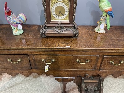 Lot 645 - George III oak low dresser.