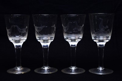 Lot 542 - Four engraved cock fighting wine glasses