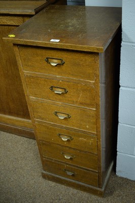 Lot 75 - An oak chest of filing drawers and a walnut display cabinet