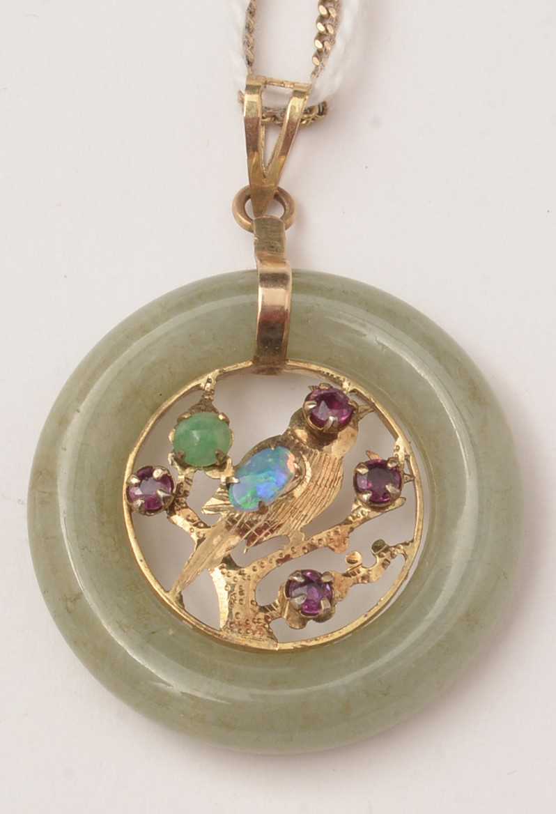 Lot 50 - A jade coloured stone and gemstone pendant