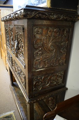 Lot 220 - A substantial ornate oak carved cupboard