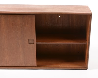 Lot 638 - Attributed to G-Plan: a wall-mounted teak bookcase/cabinet.