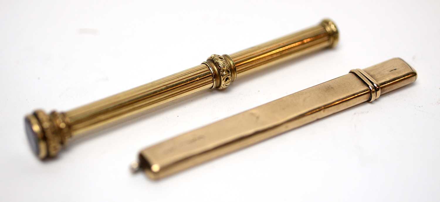 Lot 176 - A 9ct gold cased Edwardian fob pencil and a Victorian propelling pencil.