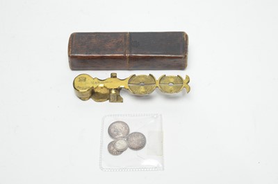 Lot 247 - A set of brass sovereign scales and silver coins.