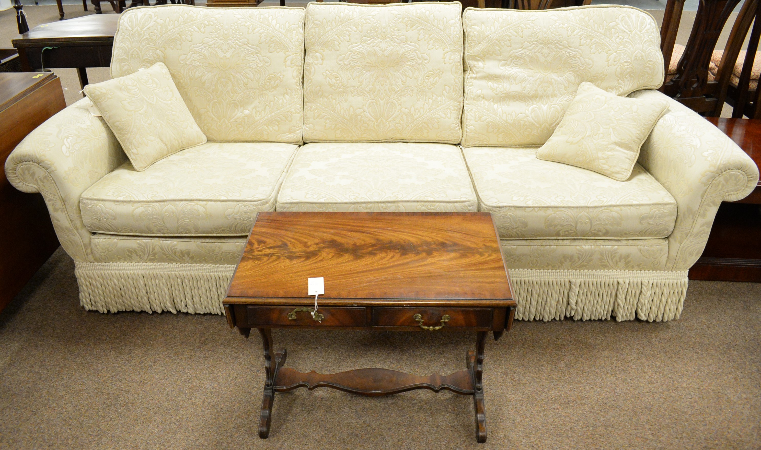 Lot 32 Peter Guild threeseater sofa.