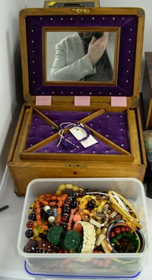 Lot 216 - An early 20th Century stained oak sewing box and a selection of costume jewellery