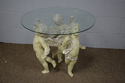 Lot 64 - A glass-topped occasional table